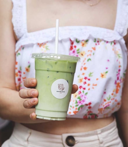 girl holding iced matcha  | Madame Bonte